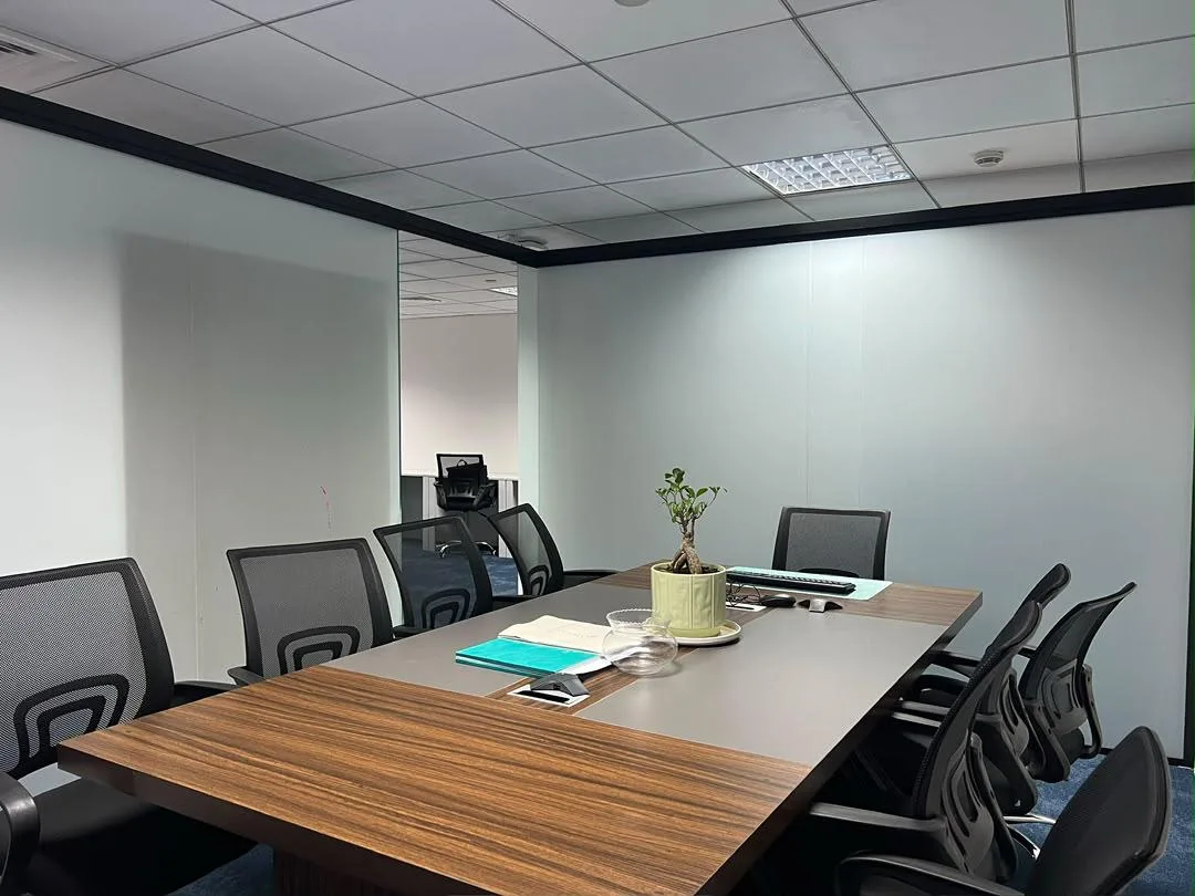 CNK Real Estate meeting room with a wooden conference table and chairs